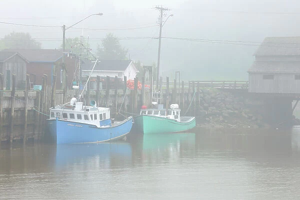 FIshing boats in fog Saint Martins New Brunswick, Canada