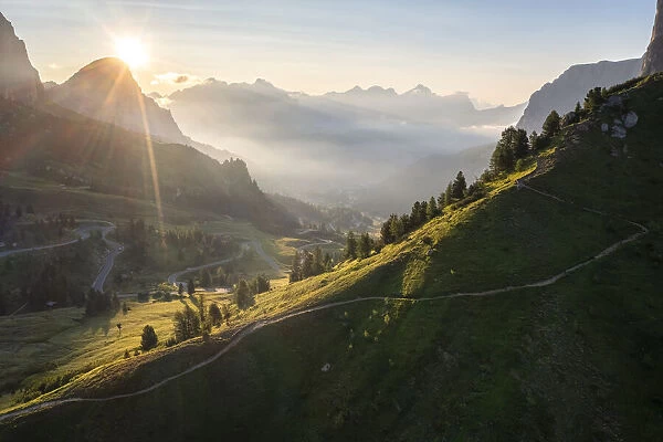 Gardena Pass and Sassongher at dawn. Dolomites, South Tyrol, Bolzano district, Italy