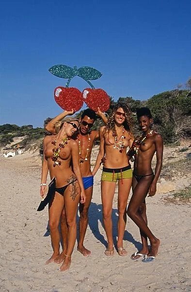 Happy people on the beach in Ibiza
