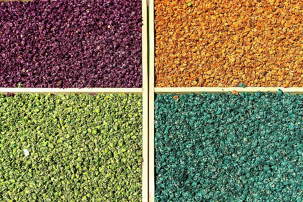 High angle view of colorful flowers in storage compartments drying in the souks of medina, Marrakech, Morocco