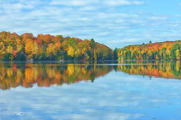 Horseshoe Lake in autumn with cottage, Near Parry Sound, Ontario, Canada