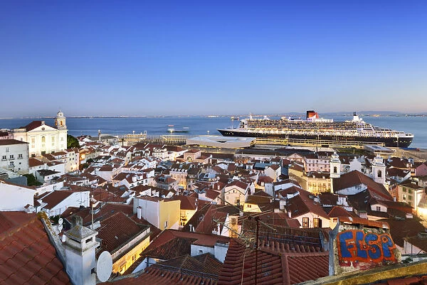 The iconic cruise ship Queen Mary II on the Tagus river facing the traditional moorish