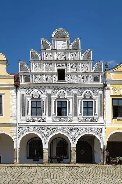 Iconic house with arcades and high gable at Zacharias of Hradec Square, UNESCO, Telc