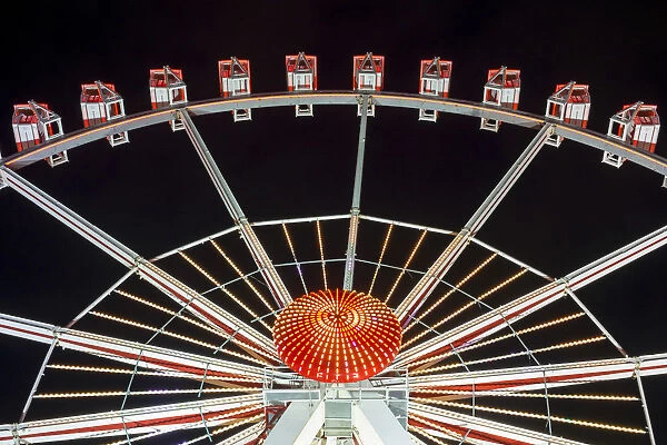 Illuminated Ferris Wheel at Hamburger DOM funfair at night, St. Pauli, Hamburg, Germany