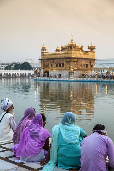 India, Punjab, Amritsar, Pilgrims at The Harmandir Sahib, known as The Golden Temple