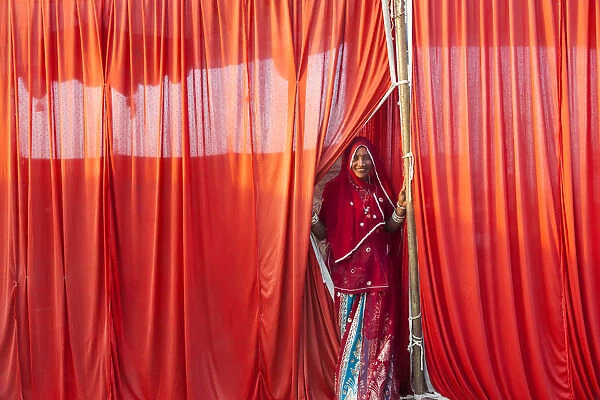 Indian woman leaving tent, Pushkar, Rajasthan State, India