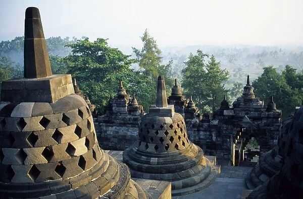 Latticed stupas on upper terraces, Borobodur temple, Java, Indonesia