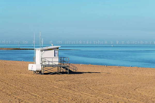 Lifeguards station at Ramsgate beach, with the Thanet Wind Farm in the background, Kent, England