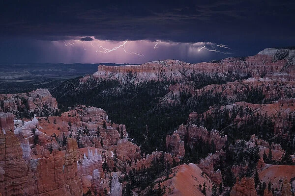 A majestic lightning storm during a summer sunset at Bryce Canyon National Park, Utah, USA