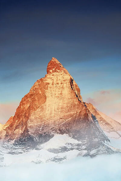 Majestic Matterhorn emerging from mist at sunrise, Gornergrat, Zermatt, Valais, Switzerland