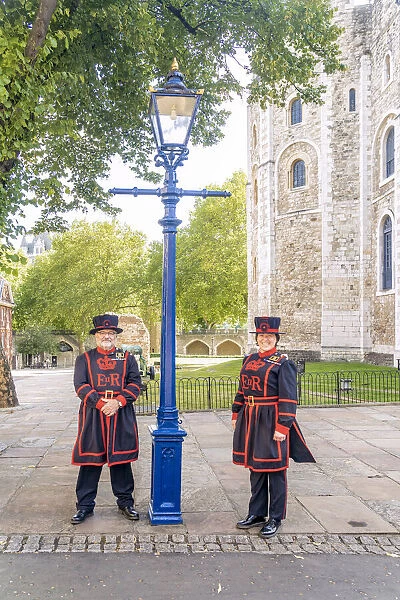 Male and female Beefeaters or Yeoman at the Tower of London, UNESCO World Heritage site