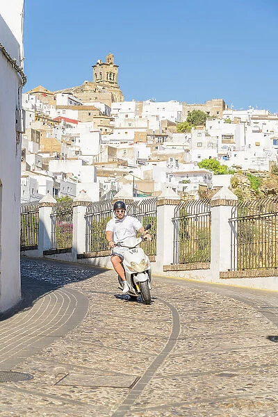 Man riding a scooter, Arcos de la Frontera, Andalusia, Spain