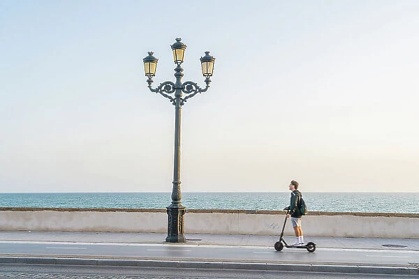 Man on a scooter, Cadiz, Andalusia, Spain