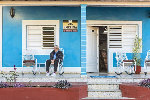 A man sitting outside his casa in Vinales, Pinar del Rio Province, Cuba