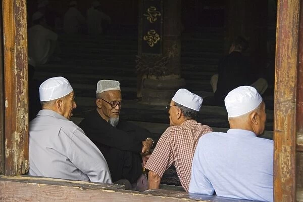 Men in the prayer hall at The Great Mosque located