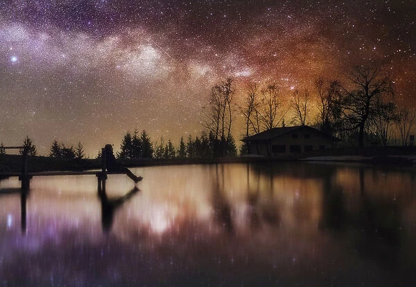 Milky way reflection in a small lake of the central Appennines, Tuscany, Italy