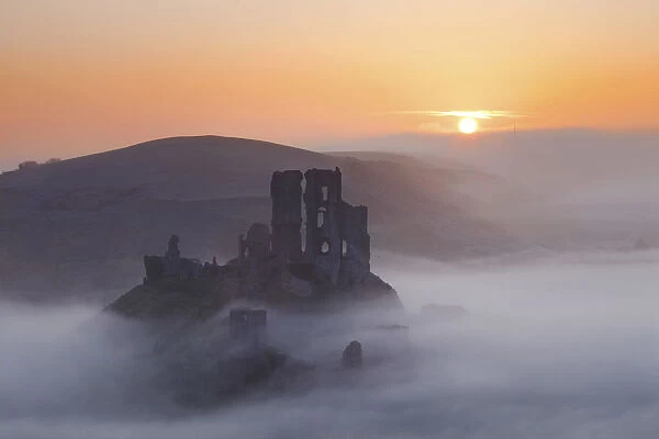 Mist below Corfe Castle at Sunrise, Dorset, England