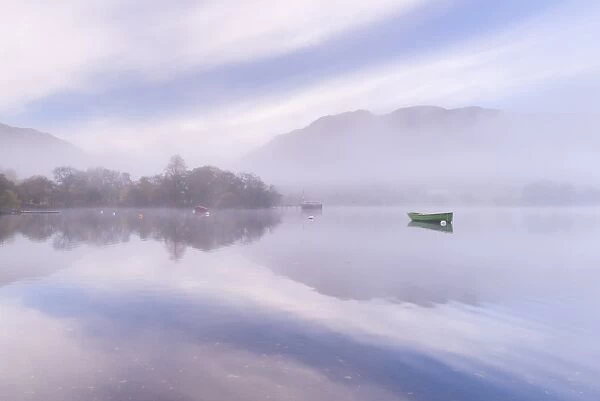 Misty autumn morning on Ullswater in the Lake District, Cumbria, England. Autumn