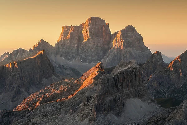 Mt. Pelmo capturing the first light of the day, seen from the Lagazuoi Hut on a summer morning. Dolomites, Italy