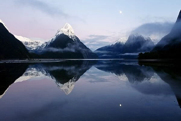 New Zealand, Nuova Zelanda, Fiordland, Milford Sound and moon during a cold and misty