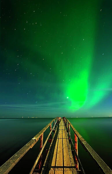 Northern lights (aurora borealis) reflected in Lake Winnipeg Matlock, Manitoba, Canada