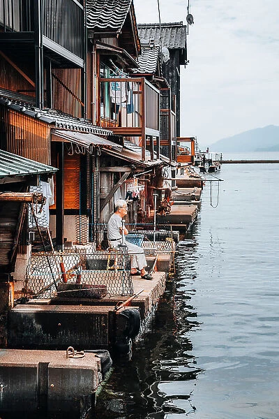 Old man at Ine fishing village, located in the Northern part of Kyoto prefecture known as the Tango Peninsula, Japan
