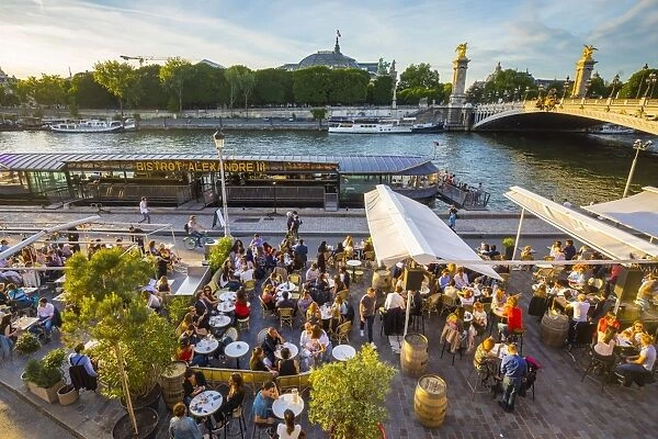 Outdoor cafe  /  restaurant by the River Seine & Pont Alexandre III, Paris, France