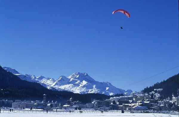 A paraglider comes into land on the frozen