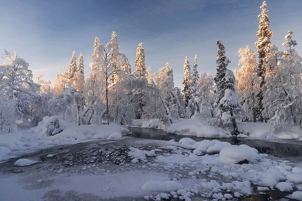 Partly frozen river in Akasmylly, Yllastunturi National Park, Lapland, Finland