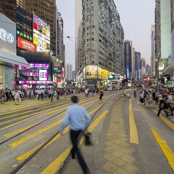 Pedestrians and traffic at a busy road crossing in Causeway Bay, Hong Kong Island