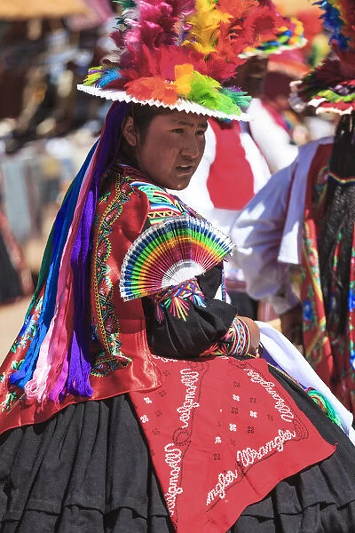 People wearing traditional costumes on Isla Taquile on the Peruvian side of Lake Titicaca