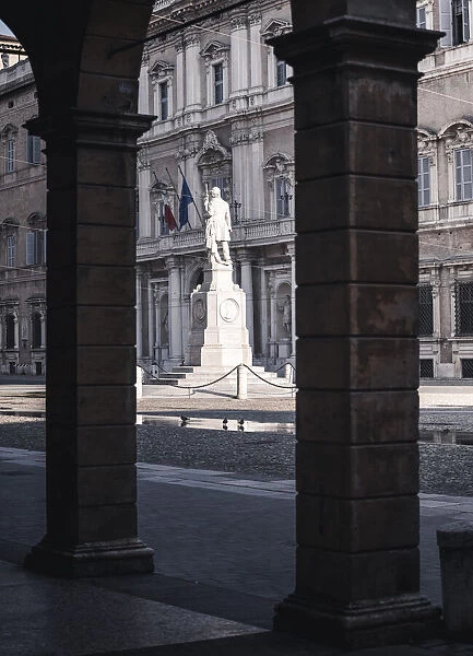 Piazza Roma, iconic square in Modena old town, with. Ciro Menotti statue Modena