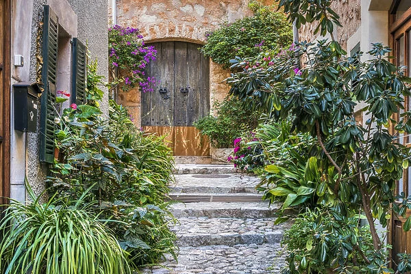 Picturesque cobbled street in the mountain village of Fornalutx, Majorca, Balearic