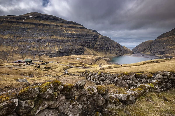 Picturesque Saksun village nestled between mountains on the island of Streymoy, Faroe Islands, Denmark