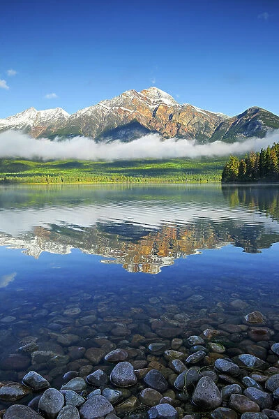 Pyramid Mountain reflected in Pyramid Lake and the Canadian Rocky Mountains, Jasper National Park, Alberta, Canada