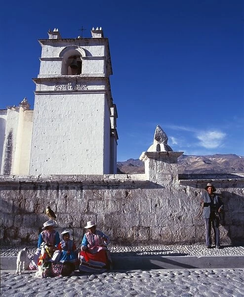 Quechua family outside Sibayo village church