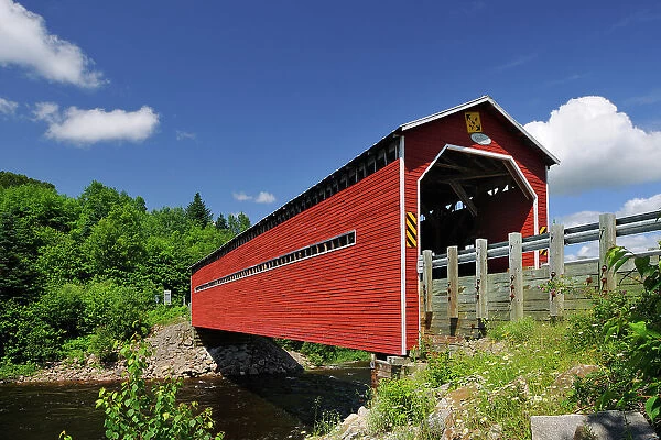Red covered bridge (Pont Louis-Gravel) crossing the Riviere Sainte-Marguerite