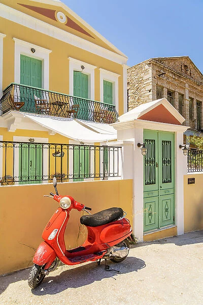 A red Vespa scooter in Symi, Dodecanese Islands, Greece