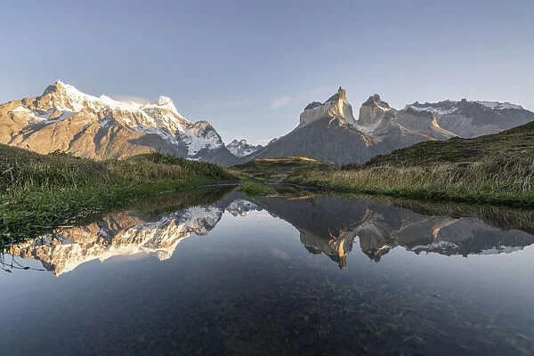 Reflection of Cerro Paine Grande, Cuernos del Paine and Cerro Paine peaks in the morning