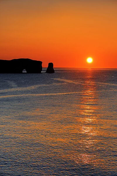 Rocher perce and sunrise over the Atlantic Ocean