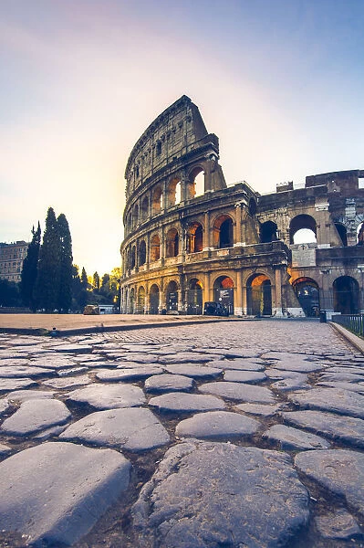 Rome, Lazio, Italy. Colosseum and Via Sacra at sunrise