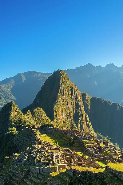 Ruins of historic ancient archeological Incan Machu Picchu on mountain in Andes, Cuzco Region, Peru