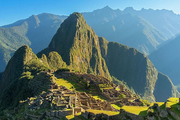 Ruins of historic ancient archeological Incan Machu Picchu on mountain in Andes, Cuzco Region, Peru