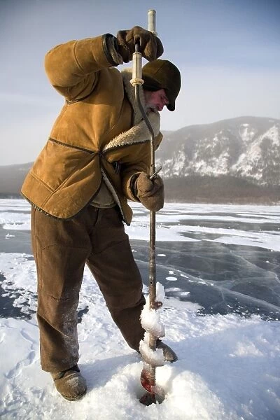 Russia, Siberia, Baikal; Undergoing preparations for fishing on frozen lake baikal in winter