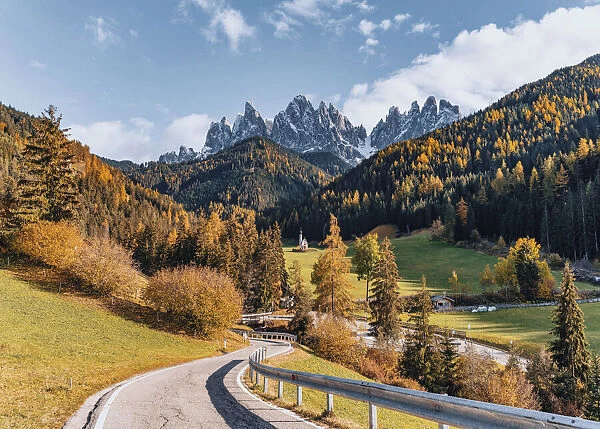 Santa Maddalena Church and road. Autumn landscape scenics, Trentino Alto Adige