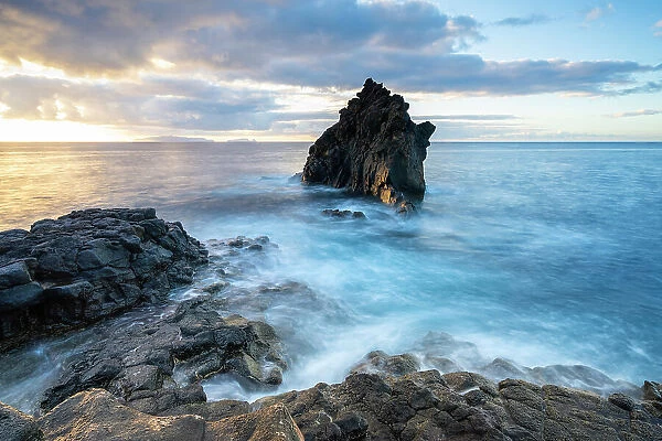 Seascape at rocky coast of Santa Cruz at sunrise, Madeira, Portugal