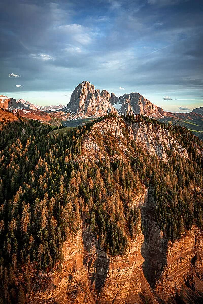 Spring woods on Sassolungo group, Sassopiatto, Gardena Valley and Seceda at sunset, aerial view, Dolomites, South Tyrol, Italy