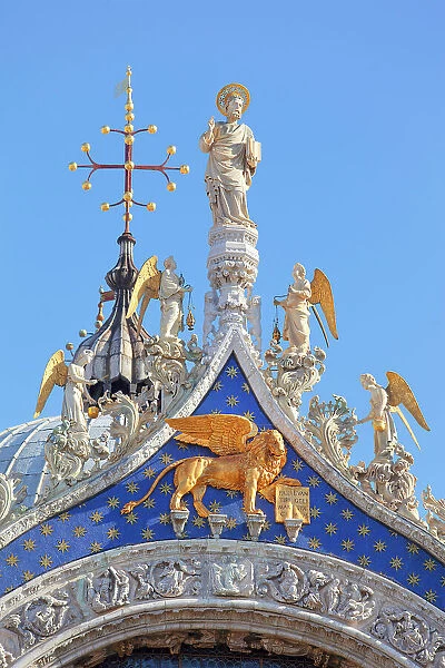 A detail of the St Mark's Basilica church gable showing Venice patron Apostle St. Mark with the angels, Saint Mark square, Venice, Veneto, Italy, Europe
