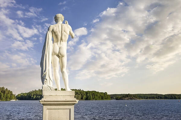 statue in front of Drottningholm Palace overlooking Lake Malaren, Sweden