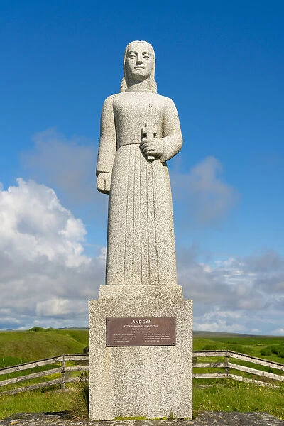 Statue of Landsyn by Gunnfridi Jonsdottur near Strandakirkja church on sunny day, Selvogur, Reykjanes Peninsula, Iceland